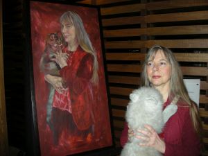 Lucy Sussex with portrait of herself by artist Dora Levakis, from the Archibald Prize's 'Salon des Refusés'